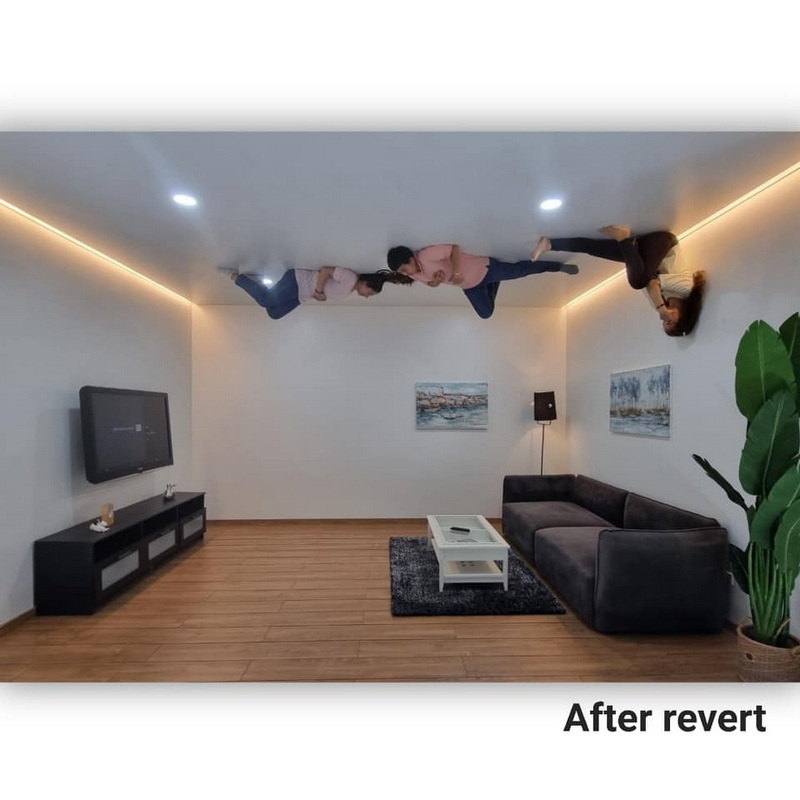 Four individuals lying on the ceiling of a modern living room at Chiang Mai Art in Paradise.