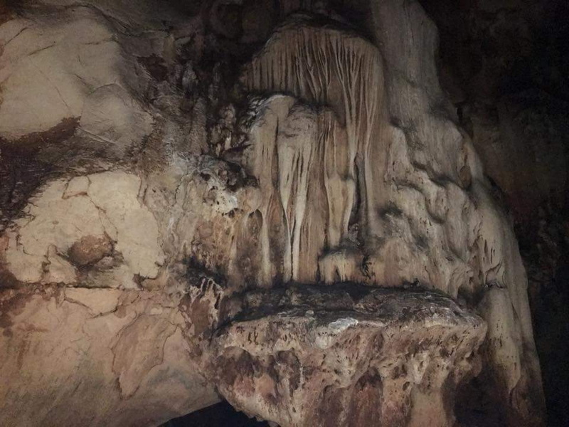 Cave Interior with Mineral Formations at Chiang Dao Cave Close-up of stalactites and stalagmites inside a dark underground cave at Chiang Dao Cave.
