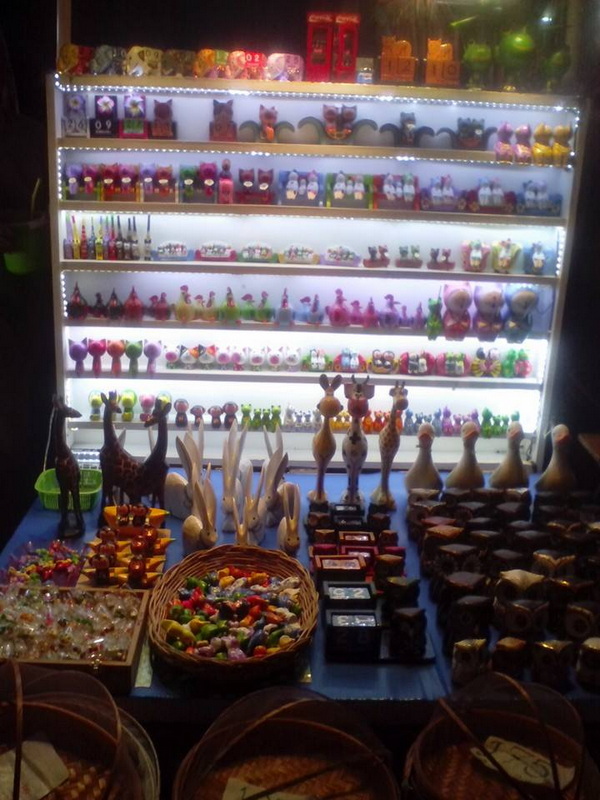 Colorful Toy Display at Sun Day Walking Street Chiang Mai Colorful toy figures and accessories arranged on shelves and tables in a shop at Sun Day Walking Street Chiang Mai.