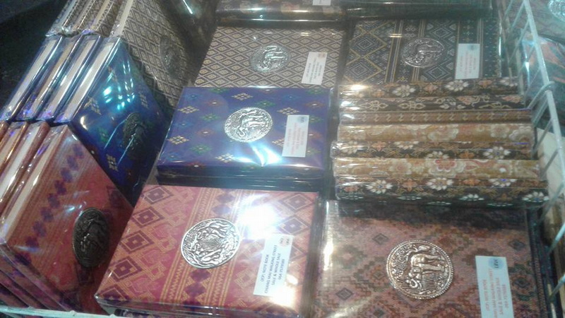 Decorative Fabrics and Items Display at Sun Day Walking Street Chiang Mai Display case with patterned fabrics and decorative items inside a shop at Sun Day Walking Street Chiang Mai.