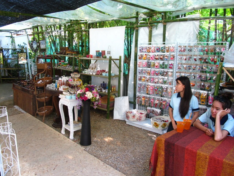 Market stall with jewelry and crafts inside a shaded outdoor area at Nimmanhaemin road.