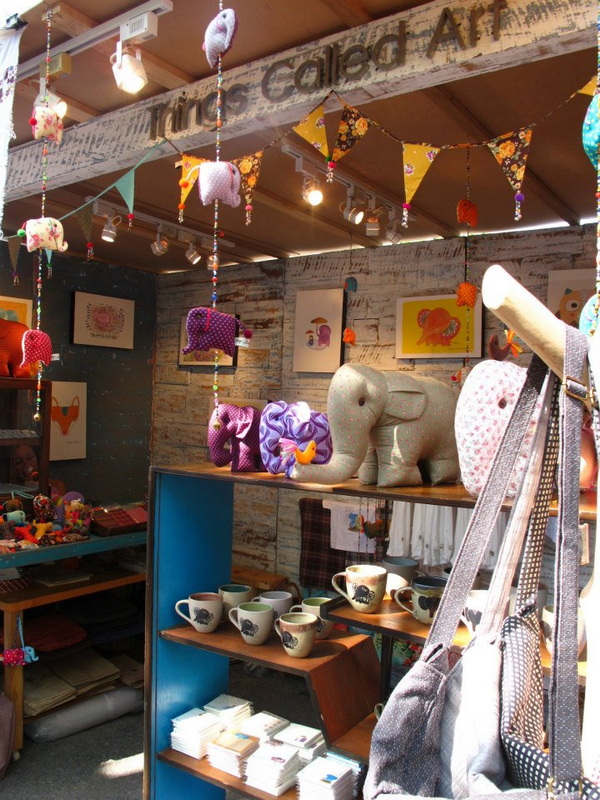 Shop interior with plush toys, ceramic cups, and hanging decorations in Chiang Mai markets at Shopping In Chiang Mai.