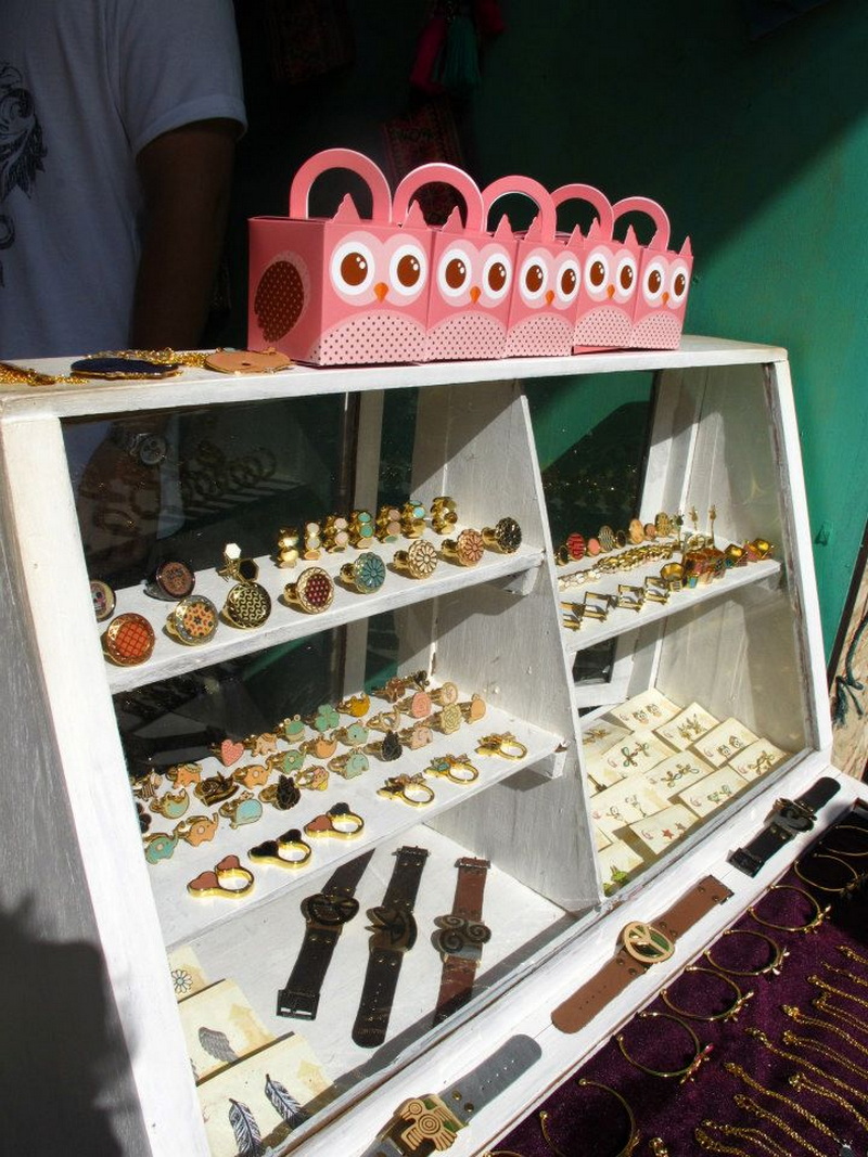 Jewelry showcase with rings, earrings, and watches in a shop display at Nimmanhaemin road.