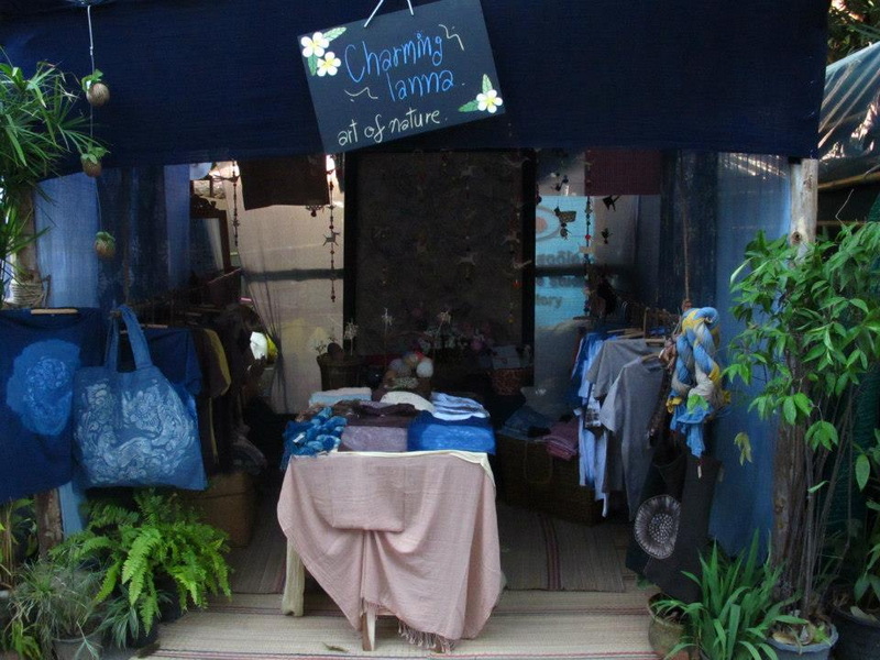 Outdoor Clothing Stall at Nimmanhaemin road Outdoor market stall displaying clothing and fabric with greenery around it at Nimmanhaemin road.