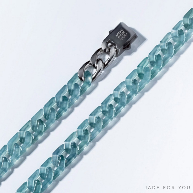 Light blue transparent chains with a silver clasp on white background at Orchid Jade Factory.