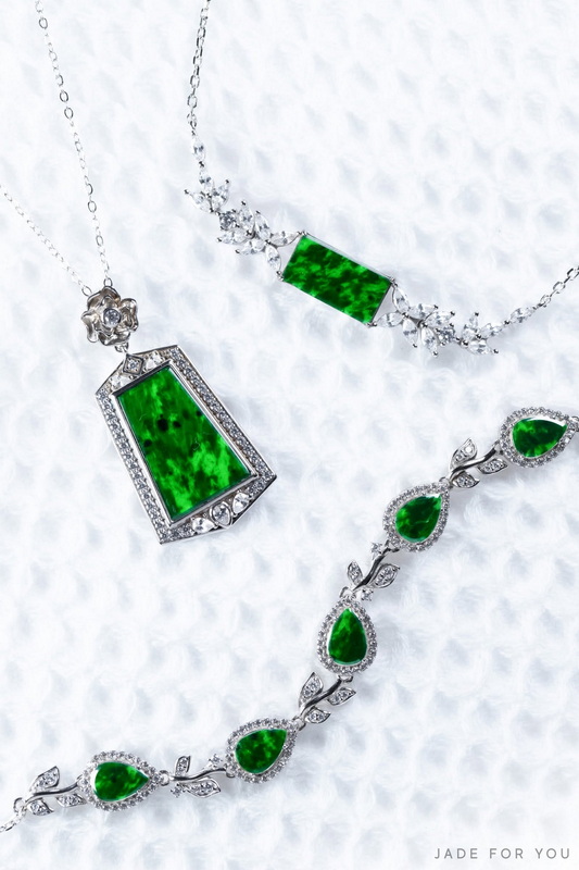 Three jewelry pieces featuring green jade stones and silver settings on a white background at Orchid Jade Factory.