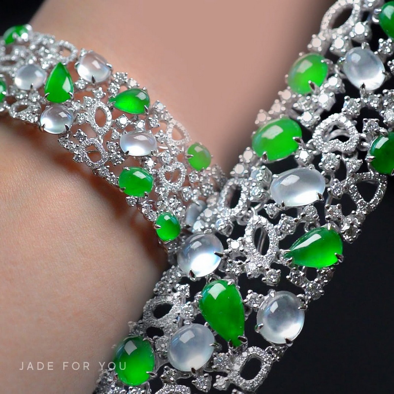 Close-up of a silver bracelet featuring green and white gemstones with detailed craftsmanship at Chiang Mai Jade Factory.