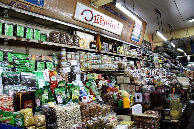 Indoor Market Shelf at Best Street Food Markets In Chiang Mai Indoor market stall with shelves filled with packaged foods and spices at Best Street Food Markets In Chiang Mai.