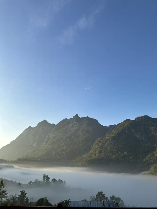 Doi Luang Chiang Dao Morning Mist Mist envelops the valley beneath the mountain peaks of Doi Luang Chiang Dao.