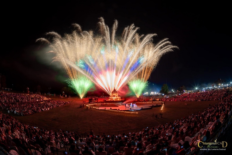Night Festival Fireworks Display at New Year Countdown Chiang Mai by CAD Bright fireworks display lighting up the night sky over a crowded festival event at New Year Countdown Chiang Mai by CAD.
