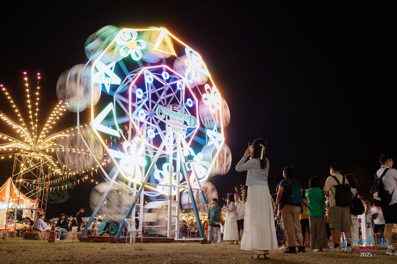 Night Festival with Ferris Wheel at Chiang Mai New Year Countdown 2027 by CAD Night scene of people near a brightly lit Ferris wheel at a festival at Chiang Mai New Year Countdown 2027 by CAD.