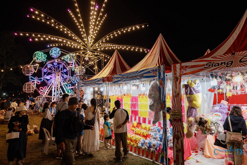 Night Carnival Festivities at Chiang Mai New Year Countdown 2027 by CAD Night carnival with tents, Ferris wheel, and visitors at a fairground at Chiang Mai New Year Countdown 2027 by CAD.