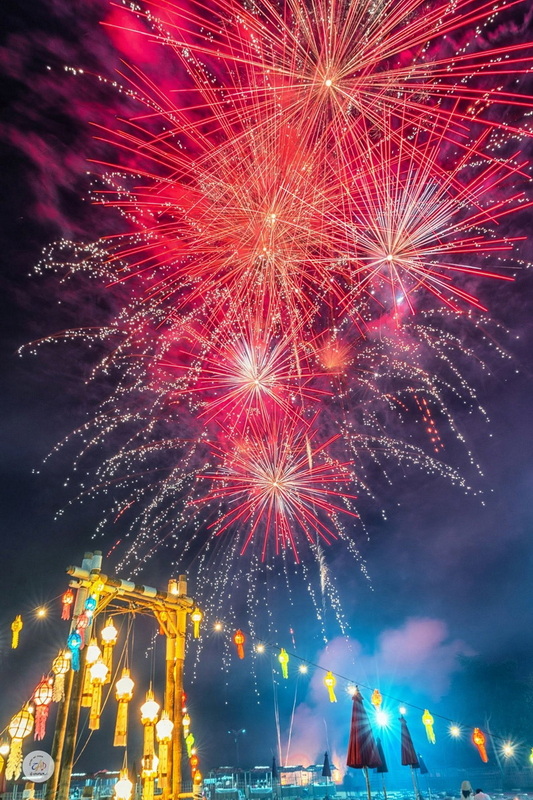 Fireworks Celebration Night at Chiang Mai New Year Countdown 2027 by CAD Bright fireworks illuminating the night sky over a decorated festive outdoor scene at Chiang Mai New Year Countdown 2027 by CAD.