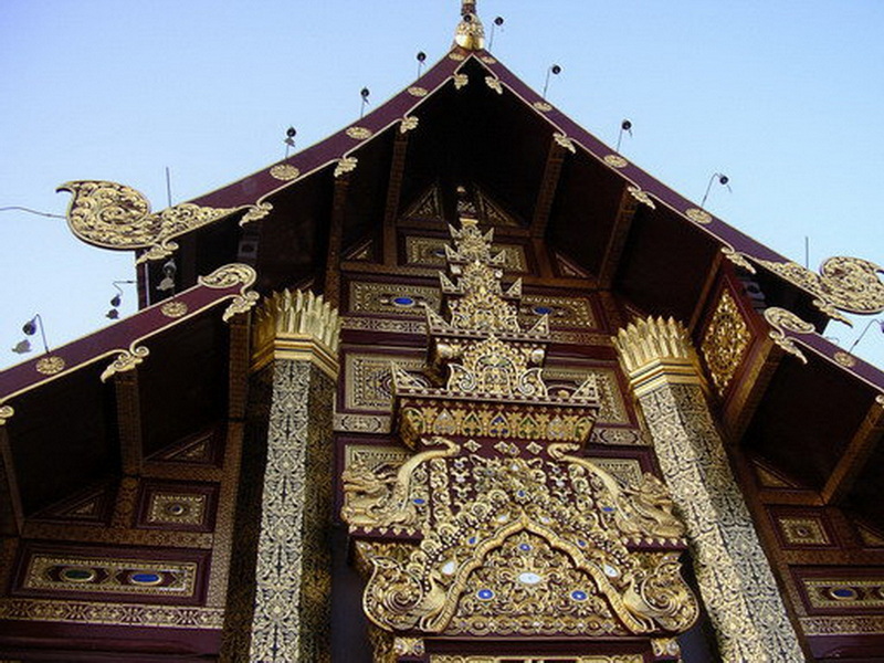 Traditional Thai Architectural Detail at Royal Flora Ratchaphruek Elaborately decorated traditional Thai building roof with gold accents and intricate carvings at Royal Flora Ratchaphruek.