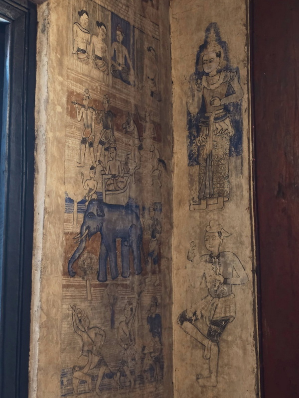 Ancient Mural Art at Three King Monument Faded traditional mural paintings on an old wall with human and animal figures at Three King Monument.
