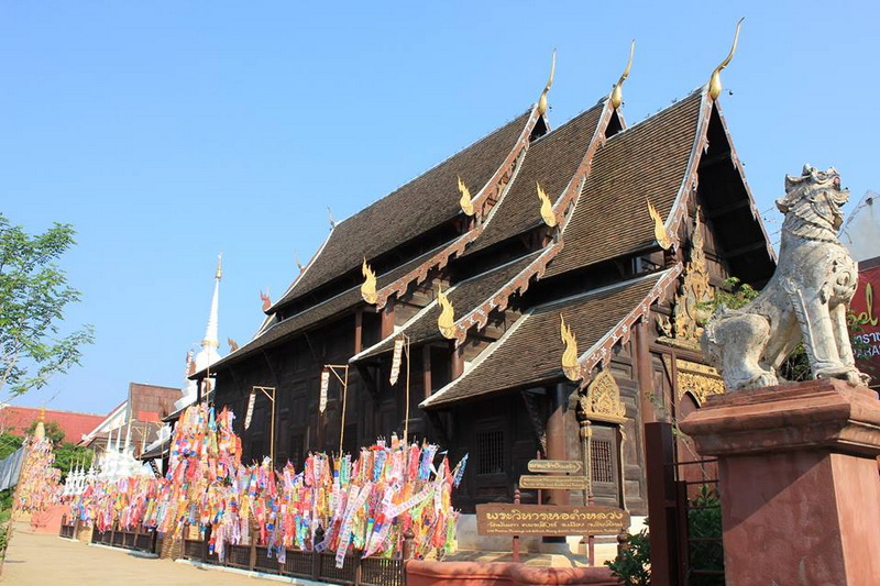 Thai Temple Architecture at Phan Tao Temple Traditional Thai temple with decorative roof and offerings outside at Phan Tao Temple.