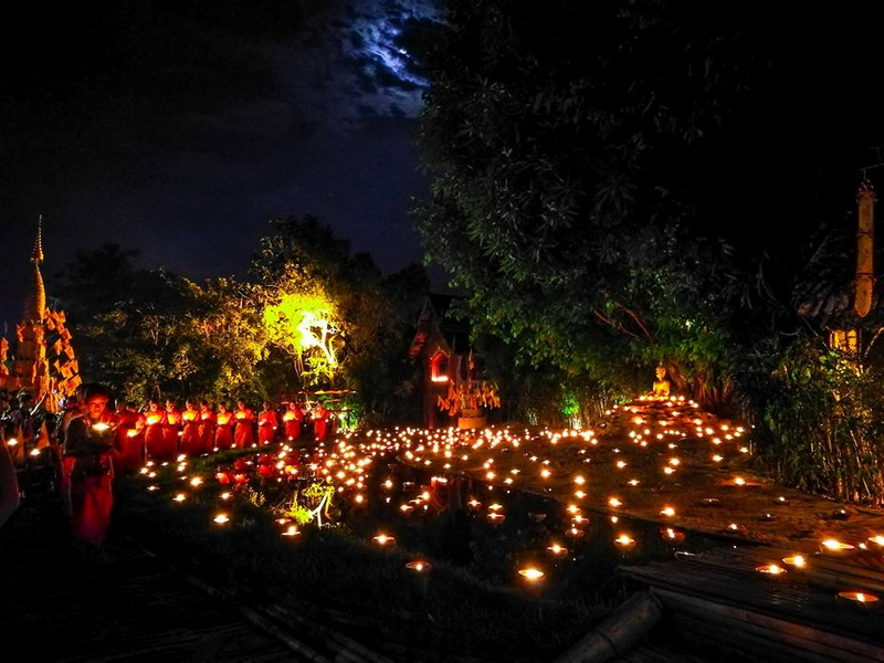 Night Lantern and Candle Scene at Phan Tao Temple Night scene with candles, lanterns, trees, and a moonlit sky at Phan Tao Temple.