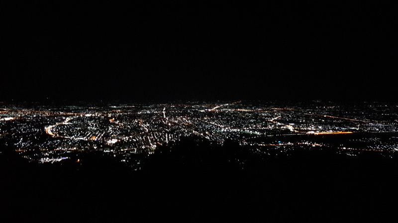 Night City View at Wat Phra That Doi Suthep Night city lights visible from an elevated vantage point across the cityscape at Wat Phra That Doi Suthep.