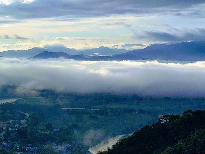 Mountain View with Clouds at Wat Thaton Mountain landscape with clouds and mist over a lush valley at Wat Thaton.