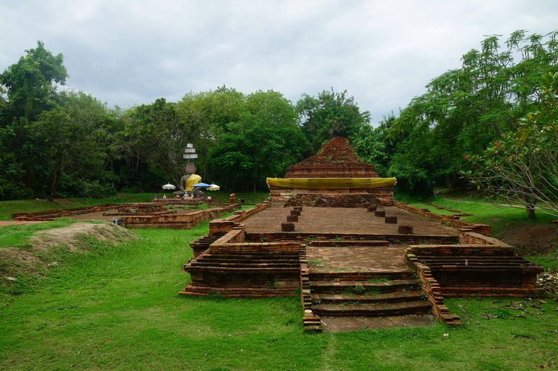 Ancient Ruins with Stairs at Wiang Kum Kam Ancient brick structure with stairs surrounded by greenery and trees at Wiang Kum Kam.