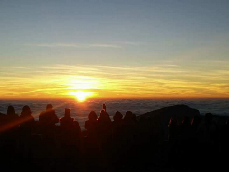 Sunset Over Clouds from Mountain at Kew Mae Pan Nature Trail Group of people viewing a sunset over clouds from a mountain summit at Kew Mae Pan Nature Trail.