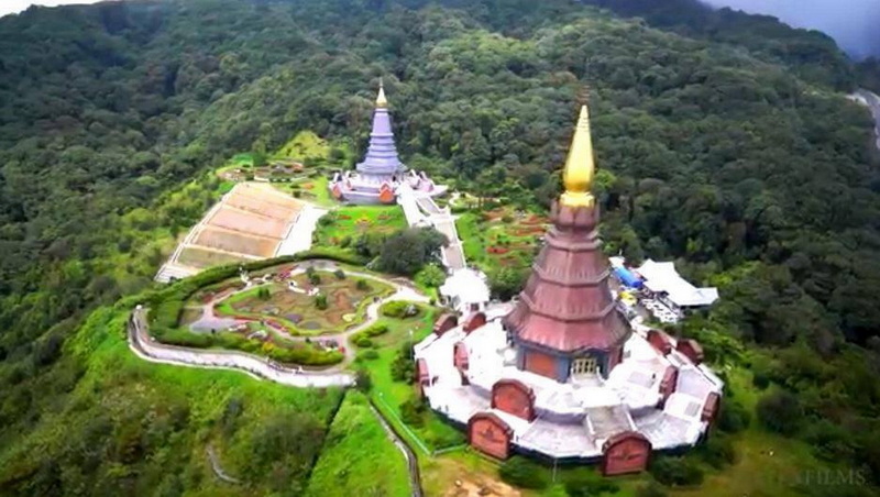 Aerial view of two pagodas amidst lush greenery and landscaped gardens at King and Queen Pagodas.
