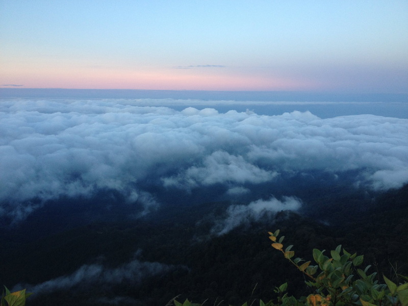 Scenic mountain view with clouds and sky from a high elevation at Doi Pha Hom Pok National Park.