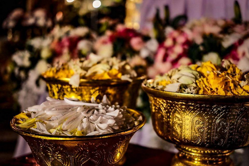 Gold bowls filled with flower petals, decorative and ceremonial scene at Nightlife In Chiang Mai Old City.