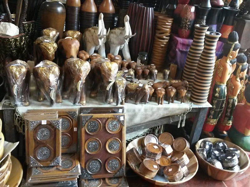 Wood Carvings Display at Baan Tawai Collection of wooden carved elephants and decorative items in a shop display at Baan Tawai.