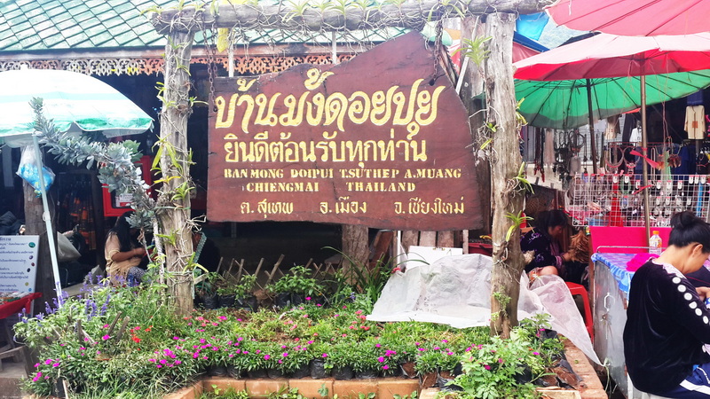 Signboard welcoming visitors at a market in Doi Pui Village, Thailand at Doi Pui Hmong Village.